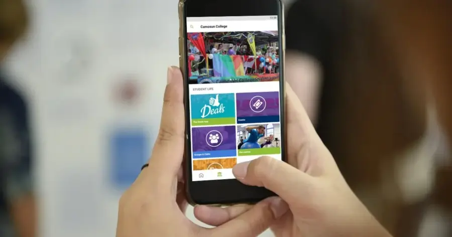 Download the Camosun Student App Hands holding phone browsing Camosun App